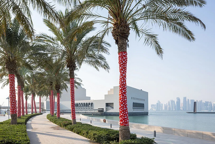 yayoi kusama`s whimsical artworks land in qatar for expansive outdoor exhibition