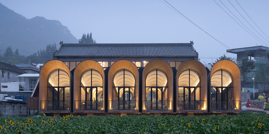 sculptural and rhythmic, these arched concrete volumes enliven the chinese countryside