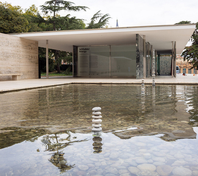 levitating pebble installation defies gravity at mies van der rohe`s barcelona pavilion