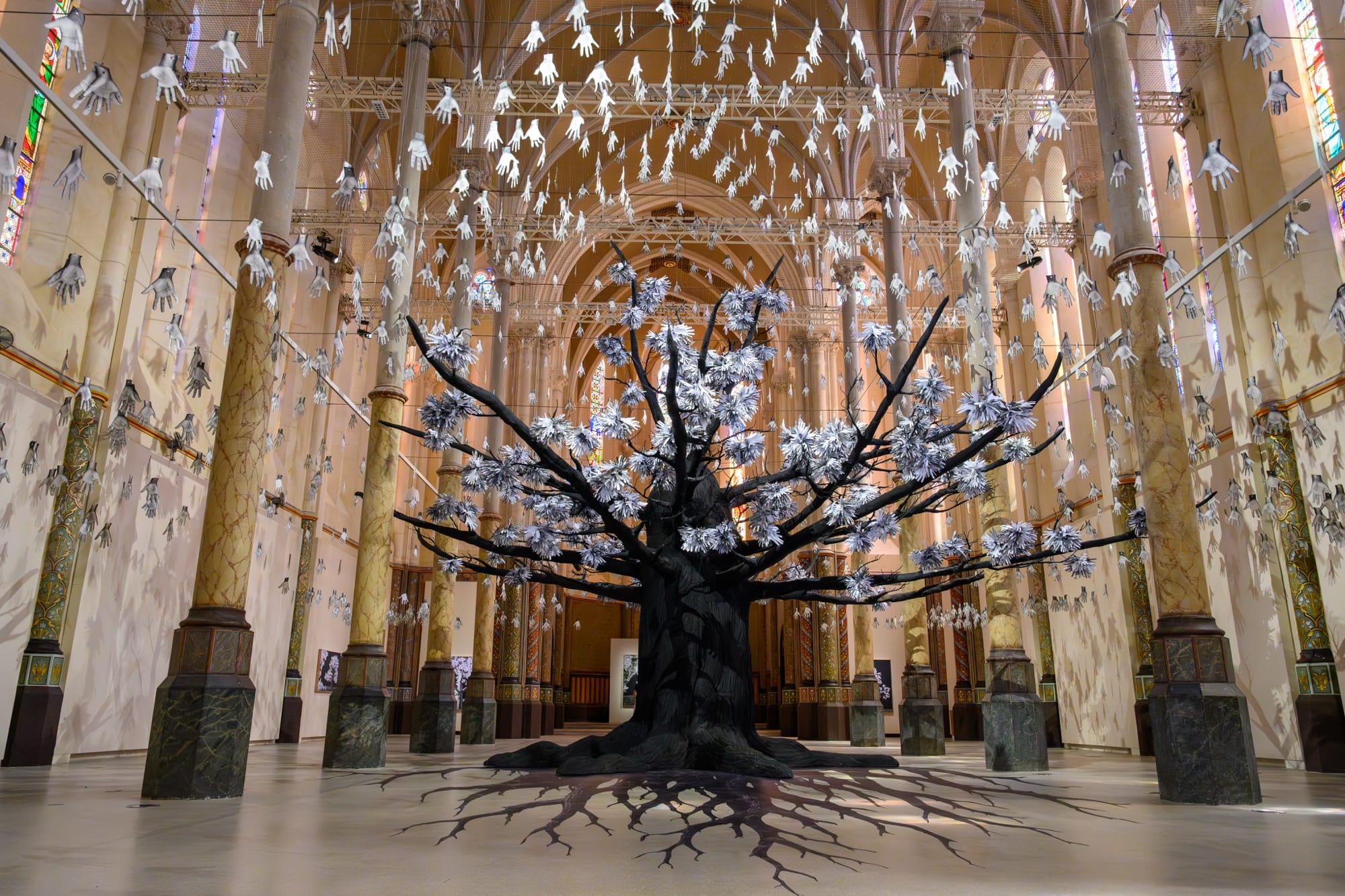 Participatory tree of scanned hands by JR grows in montpellier`s former church