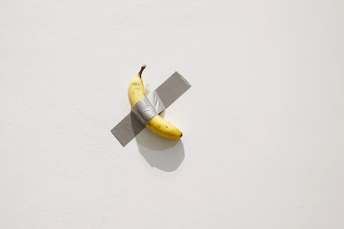 Maurizio Cattelan`s Duct-Taped Banana Sells for $6.24 M. at Sotheby`s